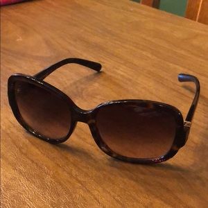 PRADA tortoise sunglasses.